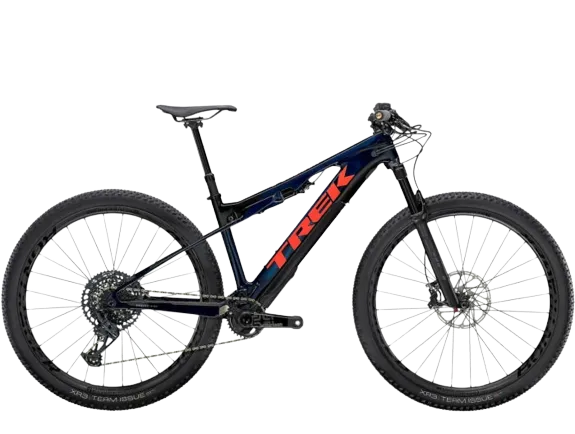 A trek e-caliber 9. 8 gx full suspension electric mountain bike, a cross-country bike in blue/coral color.