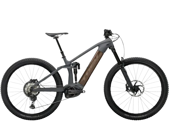 A trek rail 9. 8 xt carbon electric mountain bike, colored gray, with white background.