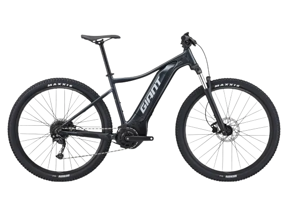 Talon e+ 29 3 in black color, with a brand sticker named giant on the frame and maxxis tires on both wheels.