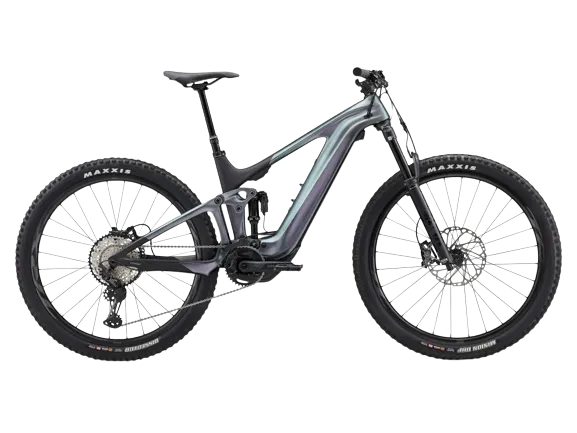 A trance x advanced e+ 1 bike in airglow color, equipped with maxxis tires on both the front and back wheels.